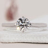 Round brilliant cut ring with solitaire setting.
