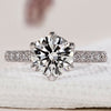 Tulip setting engagement ring with a round diamond.
