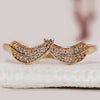 Diamond leaf ring with round diamonds in a unique design.
