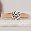 Round Diamond Engagement Ring with a wide band and prong setting, crafted in yellow gold for a timeless look.
