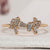 Baguette engagement ring with round diamond accents.
