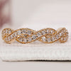 Diamond half eternity band with twisted pave design.
