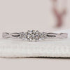 3 Stone Round Diamond Ring with a twist shank design.
