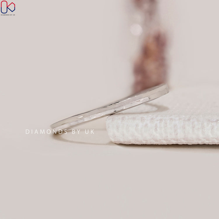 Diamondsbyuk band in white gold wedding band.