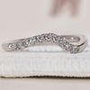 Curved Diamond Wedding Band with a sleek and elegant design.
