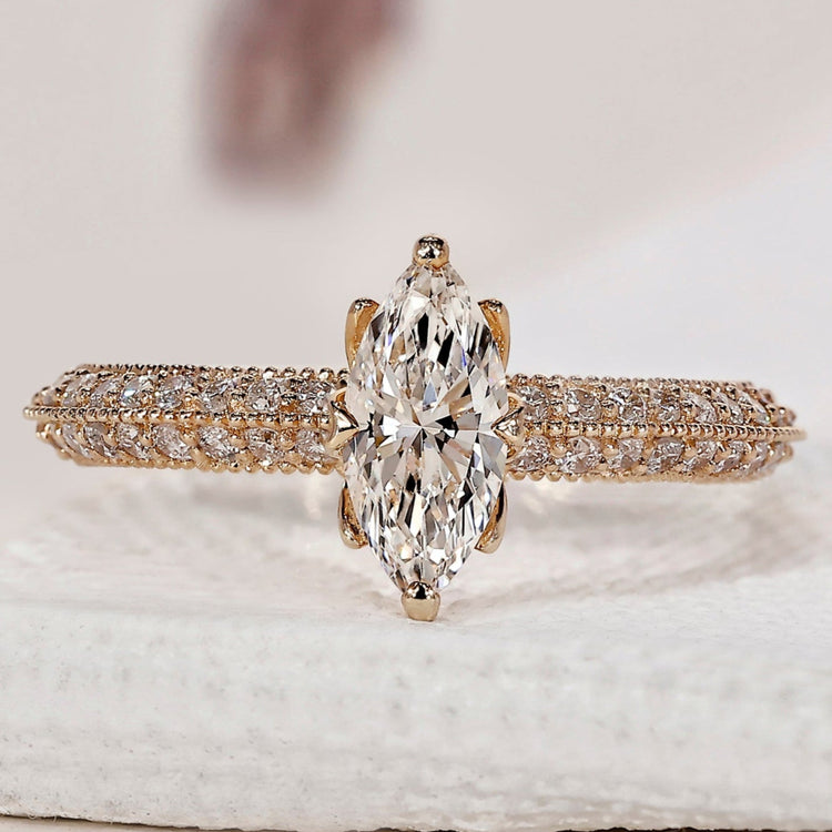 Marquise Diamond Ring with two sided pave set design.

