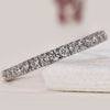 White gold diamond band with a minimalist design.

