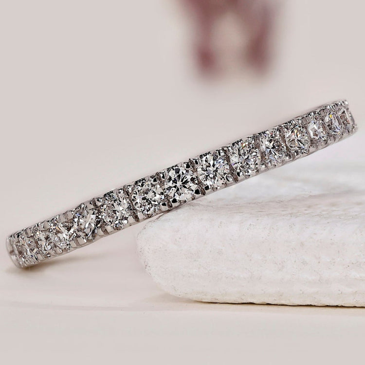 White gold diamond band with a minimalist design.
