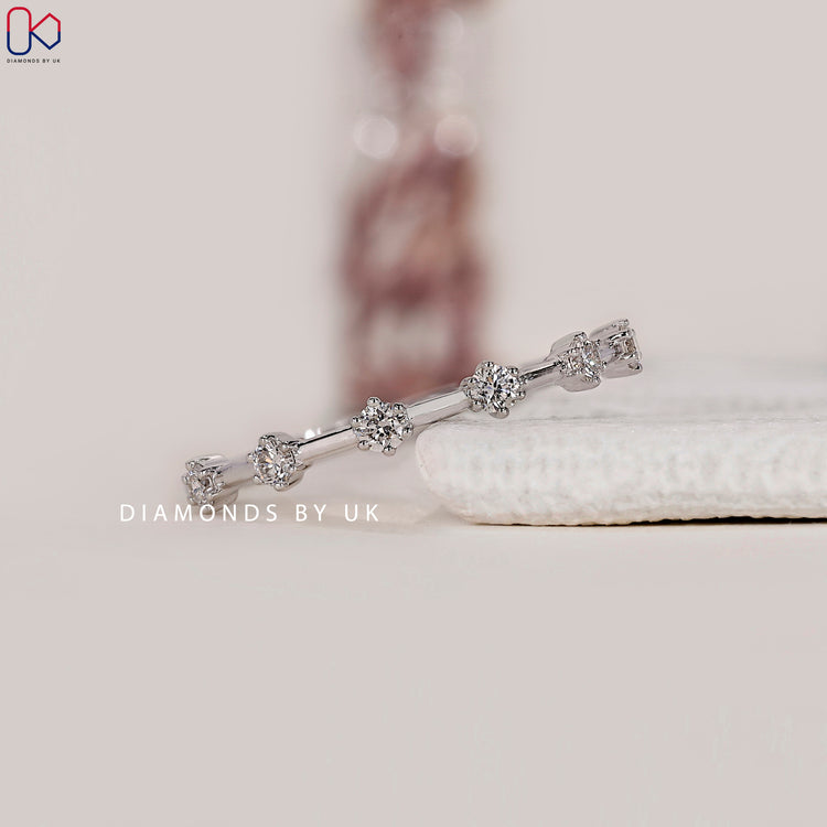 Handmade white gold diamond band by Diamondsbyuk.
