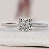 Diamond solitaire engagement ring with a sleek 4-prong setting.
