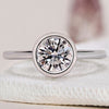 Bezel Set Diamond Ring featuring a round diamond engagement ring design with a sleek bezel setting.
