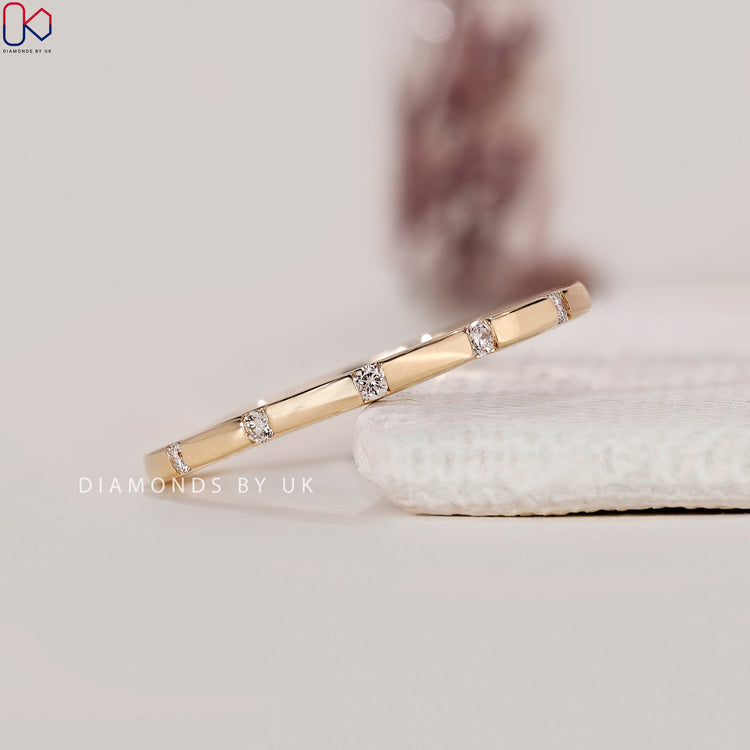 Buy diamond band with distance set round stones.
