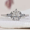 Tear Drop Diamond Ring with baguette diamond ring accents for a stunning design.