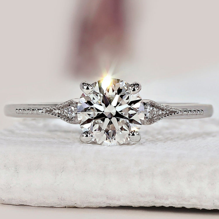 Round Diamond Side Stone Engagement Ring