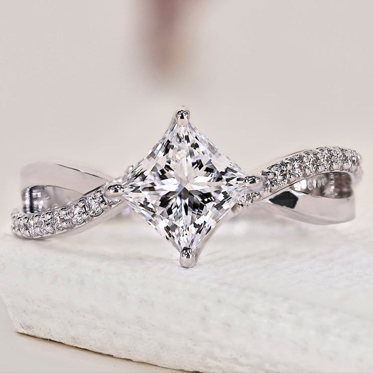 Princess cut diamond ring with a stunning white gold setting.
