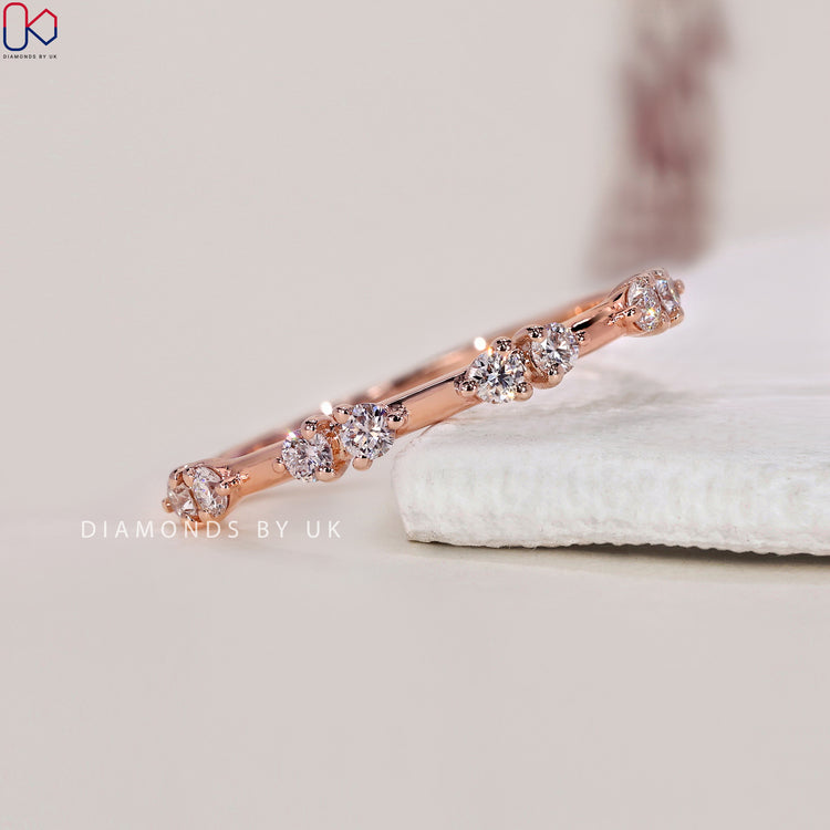 Rose gold eternity band with round diamonds set to perfection.
