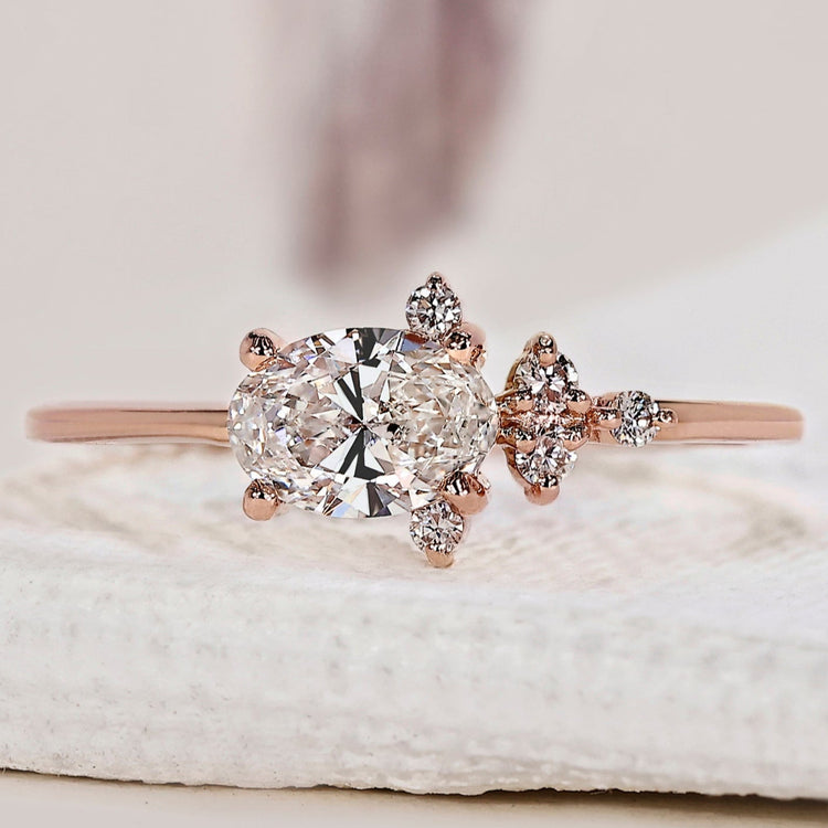 East west engagement ring with an oval diamond design.
