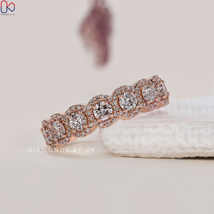 rose gold wedding band featuring seven stone diamond band
