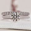 Round engagement ring band with diamonds in a classic design.

