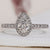 Pear Halo Engagement Ring with a stunning pear cut diamond ring centre.
