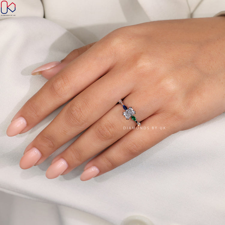 Customize ring with topaz green marquise and blue diamond.
