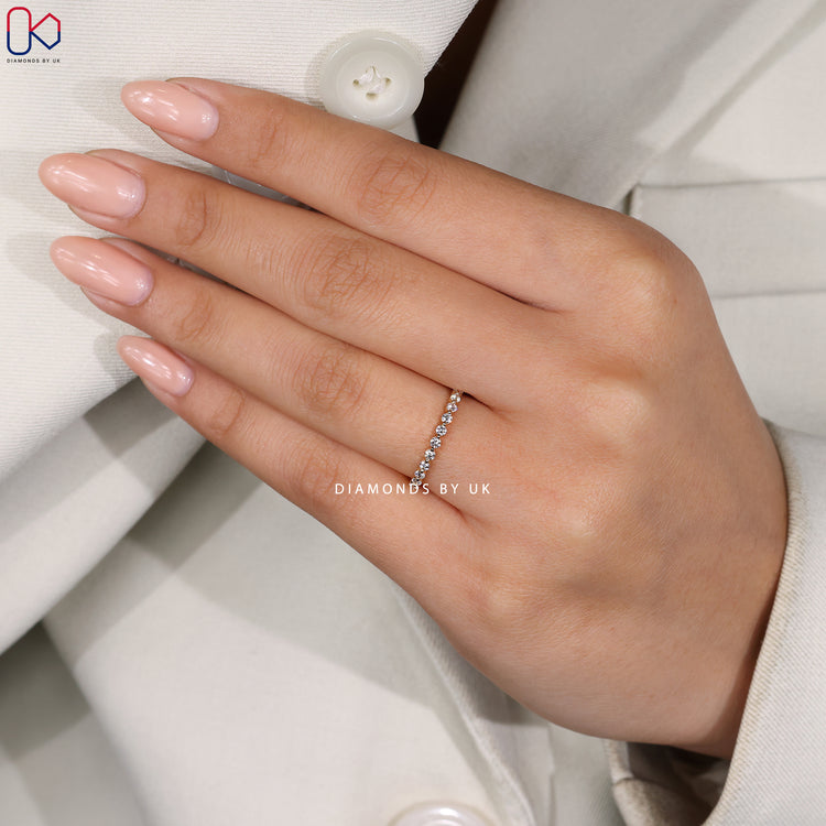 Yellow gold wedding band with sparkling diamonds.
