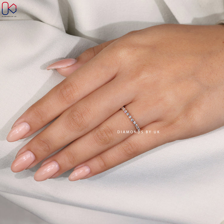 Handmade diamond band in yellow gold.
