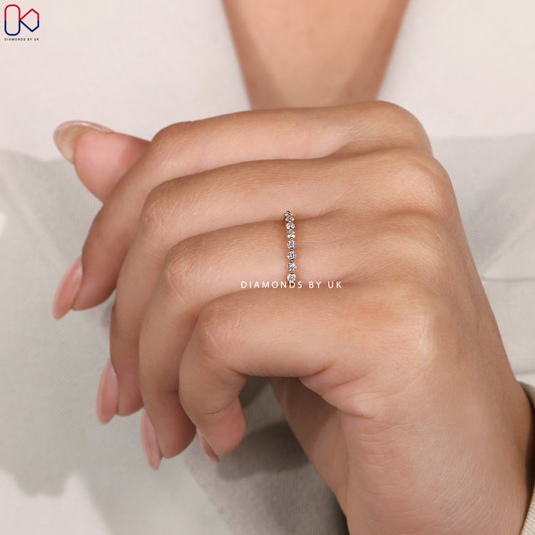 Diamondsbyuk round cut diamond band.
