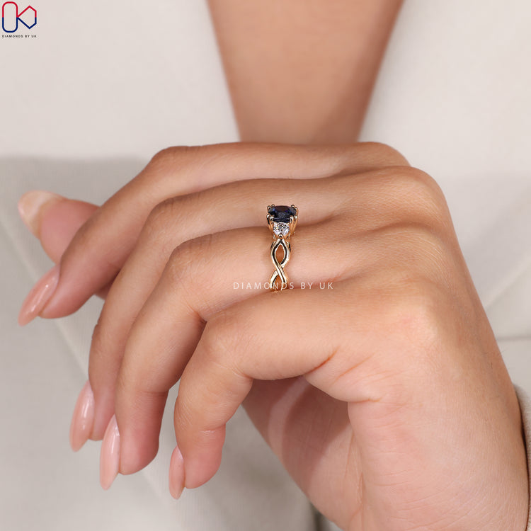 Twisted shank blue sapphire and diamond ring.
