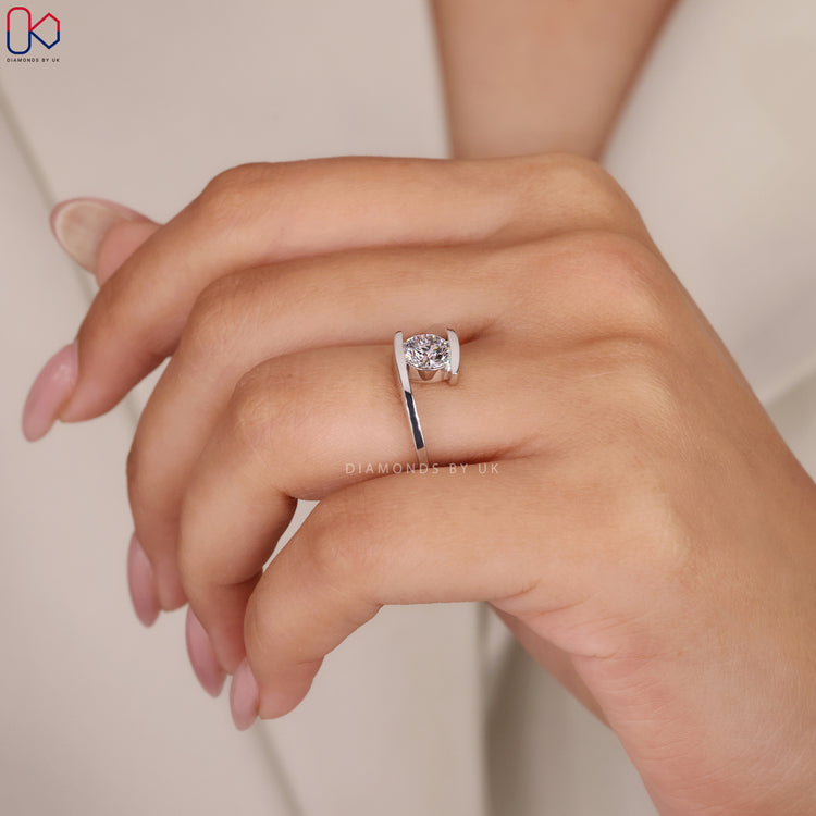 White gold diamond ring with round solitaire.
