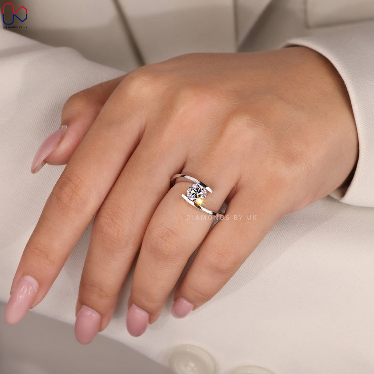 Four prong solitaire round diamond engagement ring.
