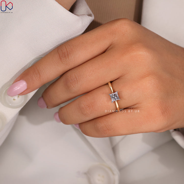 Diamondsbyuk engagement ring with a tapered shank setting.
