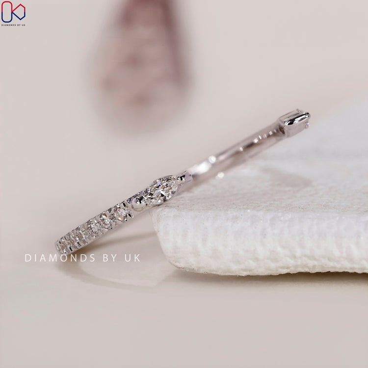 Handmade ring featuring a white gold diamond wedding band with elegance.
