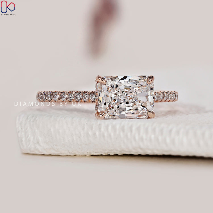 Round cut pave set engagement ring with a modern touch.
