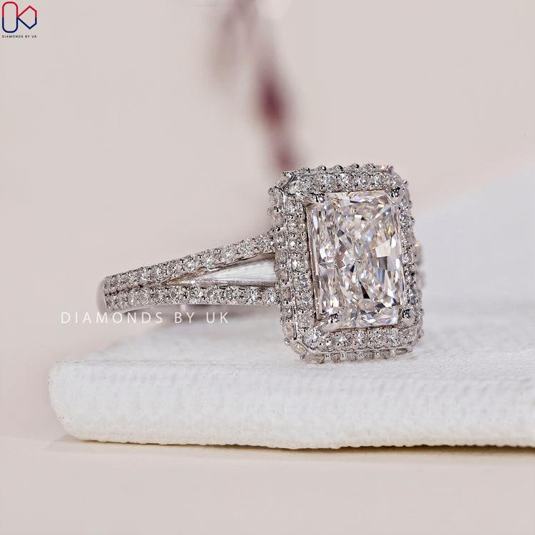 Prong setting ring showcasing a radiant cut diamond with brilliance.