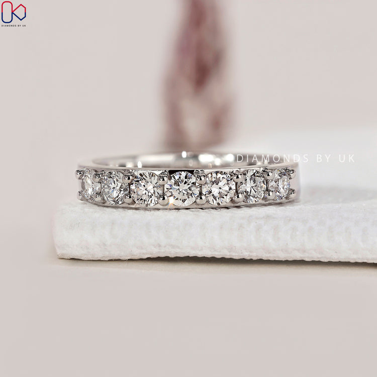 A sparkling 7 stone wedding band symbolising everlasting love.
