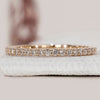 Gold eternity band with round cut lab grown diamonds in full eternity.
