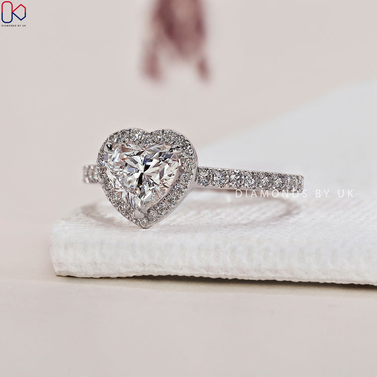Diamondsbyuk ring showcasing a dazzling heart cut diamond.