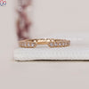 Round cut wedding band with continuous diamond design.
