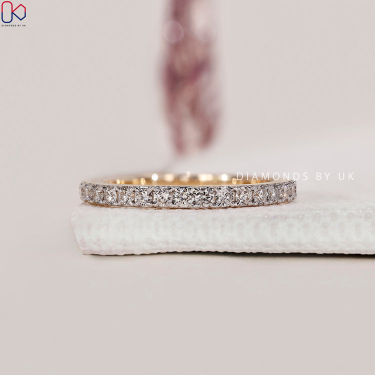 Handmade two tone band with lab grown diamonds.
