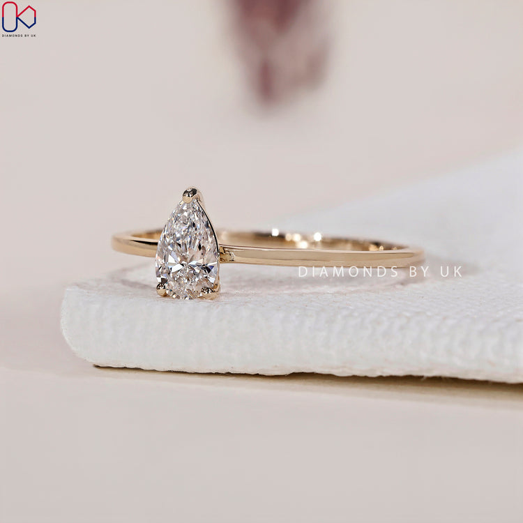 IGI certified pear cut diamond solitaire ring for a high-quality, ethical choice.
