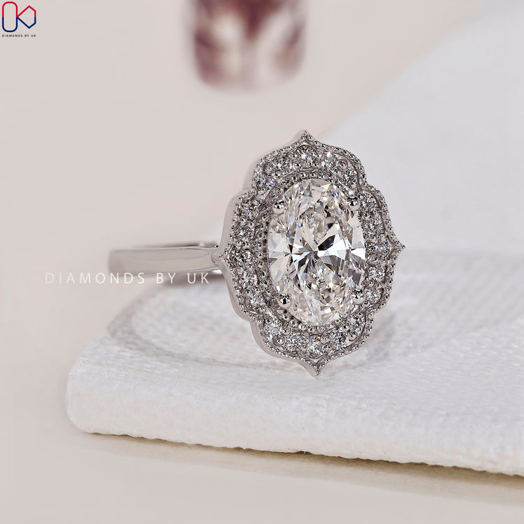 Lab Grown Diamond oval halo engagement ring for a sustainable choice.
