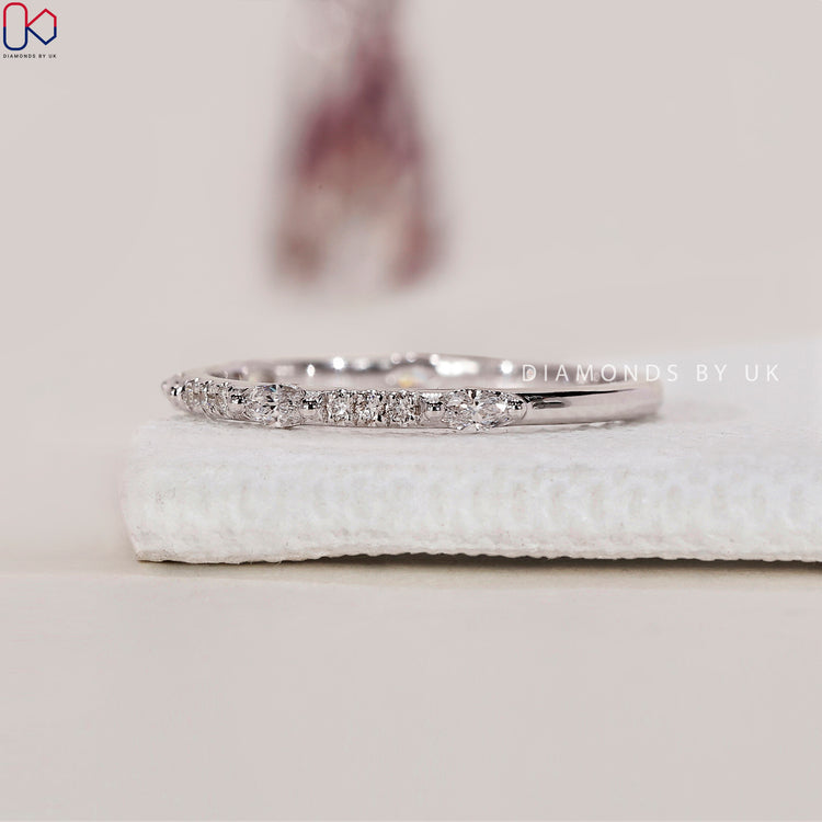 Prong set wedding band with secure and brilliant diamond placement.
