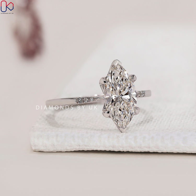 Tapered Shank Band Marquise Diamond Engagement Ring with a unique 4 prong claw setting, crafted in white gold.
