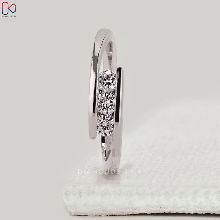 White gold wedding band with round cut stones.
