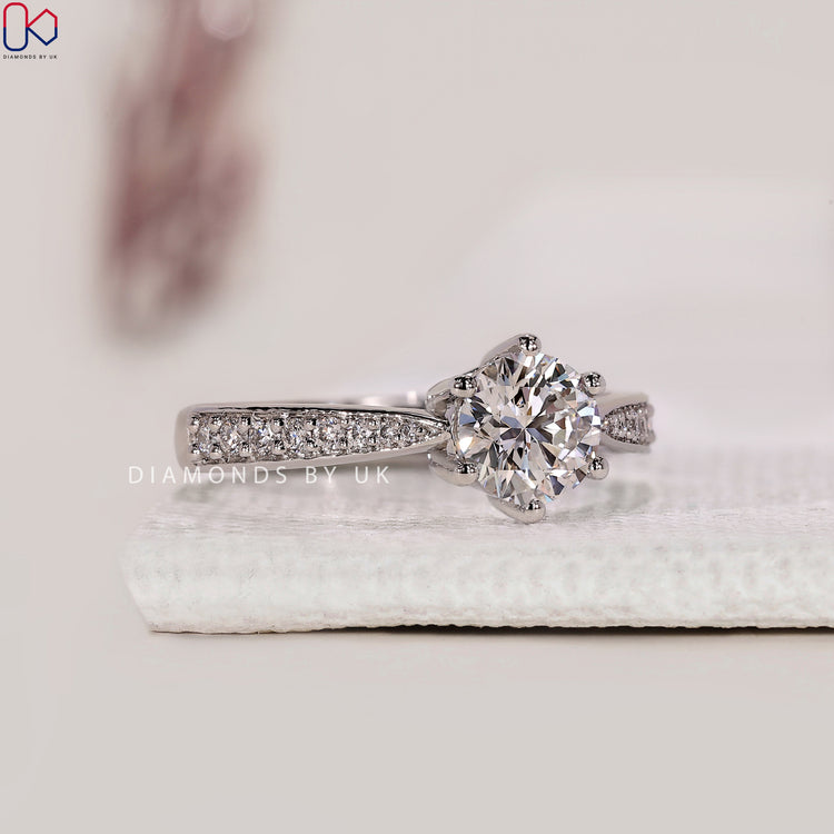 Six claw prong ring for secure diamond setting.
