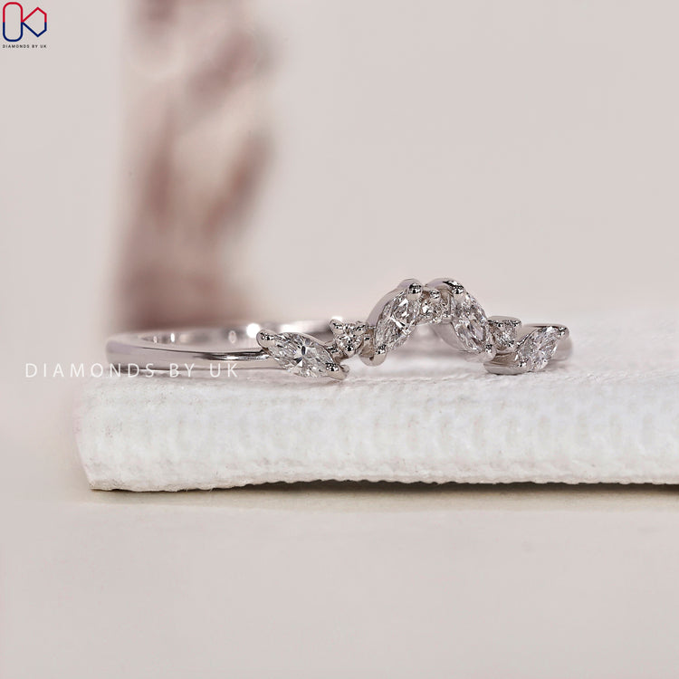 Marquise and round diamond band offering a sophisticated and dazzling look.
