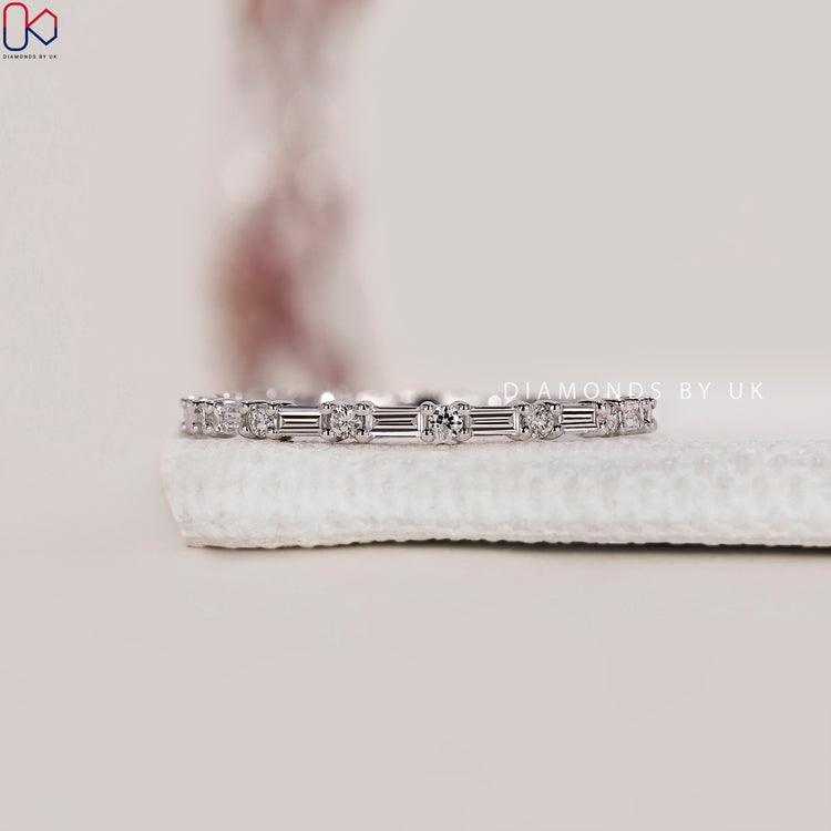 Handmade wedding ring with baguette and round cut diamonds.
