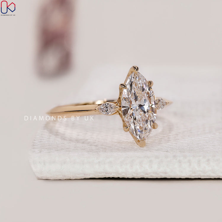 Yellow gold three stone diamond engagement ring.
