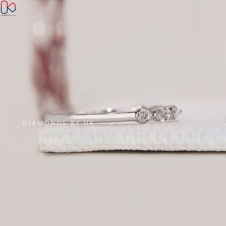 Marquise wedding band with handmade design.
